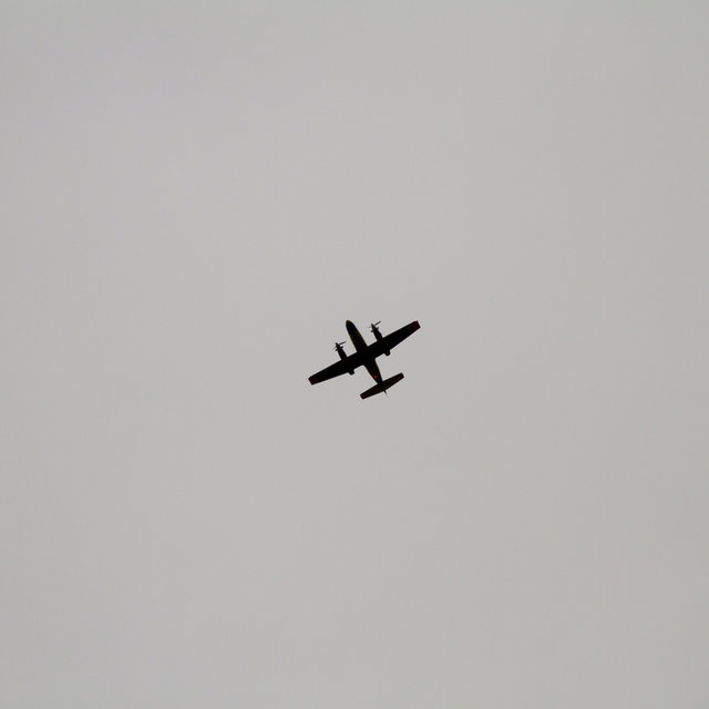Propeller aeroplane overhead.
