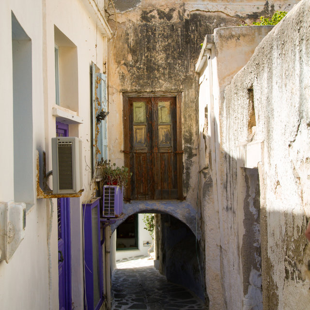 Old wodden door above an archway in Naxos.