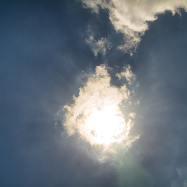 Cloud covering the sun on Nea Kameni.