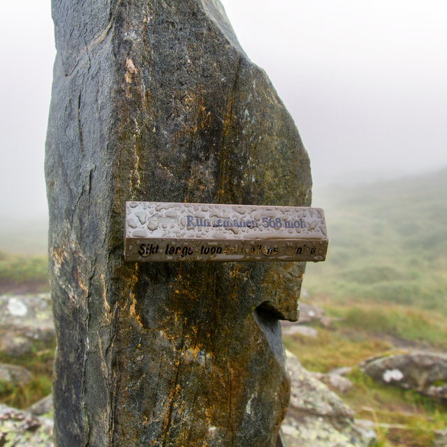 Sign on top of Mt. Ulriken indication the direction of Mt. Rundemanen.