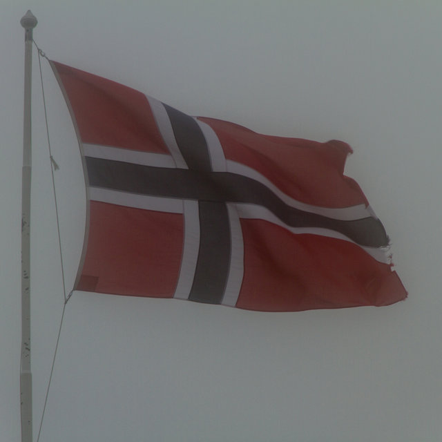 A Norwegian flag in the fog on top of Mt. Ulriken in Bergen.